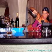 She can pose for a photo and make drinks, NICE!