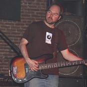 PtL's bass player rocks out to tunes from their most recent album, Achille's Heel