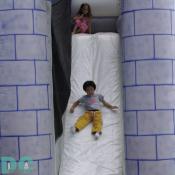 This kid has fun sliding down