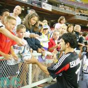"Here you go" United No.11 Eskandarian was kindly returning red shirt kid's ball with his sign.
