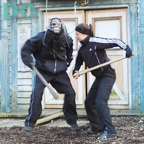 Out of nowhere a ghoul jumps out of a door to attack me. But, he stopped by this brave women.