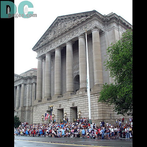 A crowd gathers in anticipation of the parade.