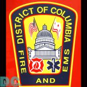 A DC Fire and EMS Emblem found on the side of a fire truck parked on the Mall.