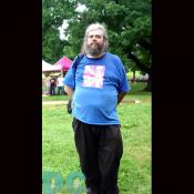 A man waits for the concert to begin.