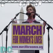 With the Washington Monument as a backdrop, Senator Hillary Clinton speaks in support of reproductive rights on April 25, 2004.