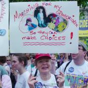 A grandmother makes her statement: MARCHING FOR MY GRANDCHILDREN, SO THEY CAN MAKE CHOICES!  Like many marchers, she wears a KERRY FOR PRESIDENT sticker.