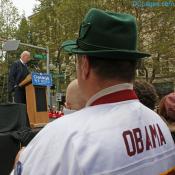 Father and son listen to Senator Joe Biden