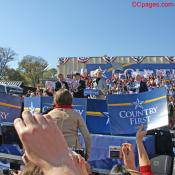 The crowd chants, "John McCain, John McCain!"