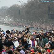 Crowd watching Beyonce on a giant LED screen
