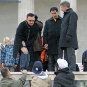 Bono goes to greet a fan