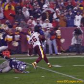 Clinton Portis runs past a falling Dallas defender.