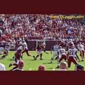 Kurt Warner (13) looks for an open receiver, but finds Redskin defenders swarming everywhere.