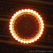 4 large solid bronze chandeliers light up the atrium. The alabaster bowls. On  the bowls there are Grecian figures surrounding the bowls.