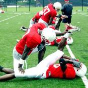 Players assist each other in their stretching.