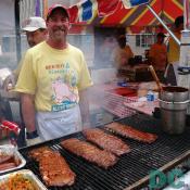 Red, Hot, and Blue restaurant cook grillings some tasty ribs.