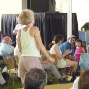 Inspired by the fiddling, this woman jumper up and started dancing