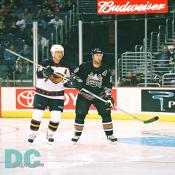 Caps defenseman Brendan Witt shadows Atlanta center Bobby Holik.