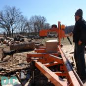 David Roy Ritter (Director of Weekend Programs), showing off the Calleva Saw Mill - responsible for the majority of the wood used in all Calleva construction projects.