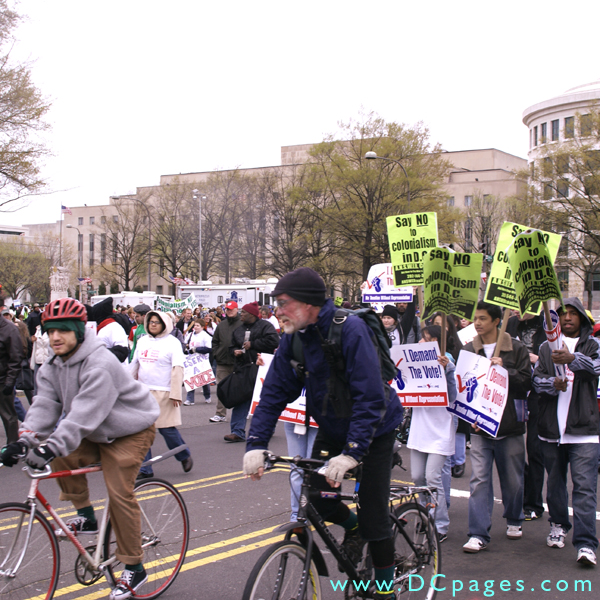 Two bikers join the march.
