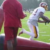 The player runs straight through them up field.