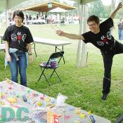 A volunteer was demonstrating how to play Wanage. (Japanese quoit game)