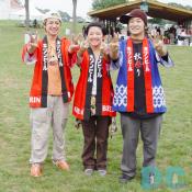 Cheerful festival staff in happi coats gave a funny pose. 