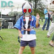 "Peace!" A little boy gave a pose with his favorite cartoon mask. 