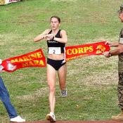 Heather Hanscom crosses the finish line and is the first woman to complete the race.