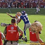 Redskins FS Sean Taylor and the Giants WR Plaxico Burress battle for this first half pass.