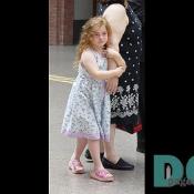 A very emotional little girl who has come to see the exhibitions with her mother.