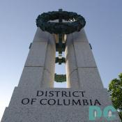 Pillar with attached bronze wreaths. DISTRICT OF COLUMBIA etched into granite.