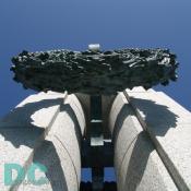 Ground to sky view of a bronze wreath.