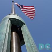 One of two American flags that frame the ceremonial entrance at 17th Street. 