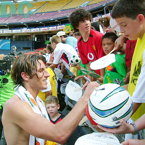 With a nice smile, Columbus Crew Frankie Hejduk was signing on a soccer ball. 