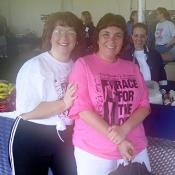 Supported by her friend, this survivor celebrates her day