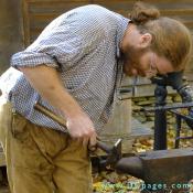 Blacksmith Eric Zieg shapes red hot metal.