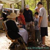 Sally Jenkins gathers a crowd around her spinning wheel.