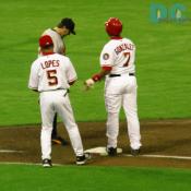Washington Nationals catcher Wiki Gonzalez talks with the first base coach after hitting a single. For the night Gonzalez was 1-4.