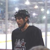 Caps enforcer, Alex Henry, heads to the locker room after one half of the scrimmage is over.