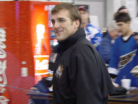 General Manager George McPhee smiles for the camera.