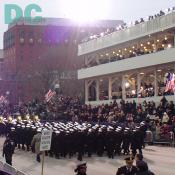 Marching performers pass Presidential Review Stand