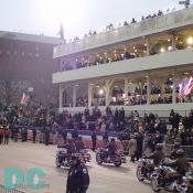 Marching performers pass Presidential Review Stand