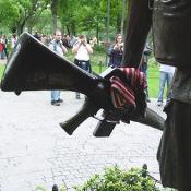 An American flag had been tucked into the hand hold of an M-16.