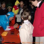Captain American takes some time off from fighting crime to show these children how pumpkins and squash grow.