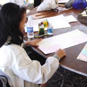 Festival participants draw tribal ancestors in the Maori Art workshop, September 10, 2003