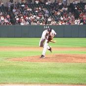 The Boston Red Sox pitcher, John Burkett throws a wide curve ball.