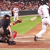 Bigbie's warm-up pays off when he connects with the ball to get the O's on base.