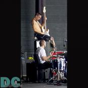 Classic rocker move: solo atop a speaker.