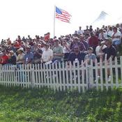 Enjoying the beautiful day, this crowd choose their seat on the hill