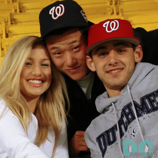 Happy Washington Nationals fans pose for the camera.